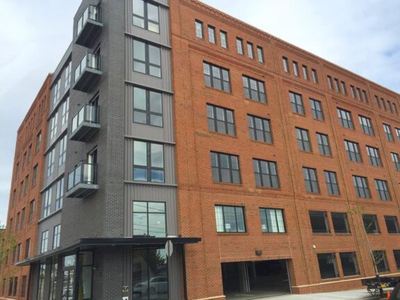 Aluminum glass railing on urban apartment building balconies