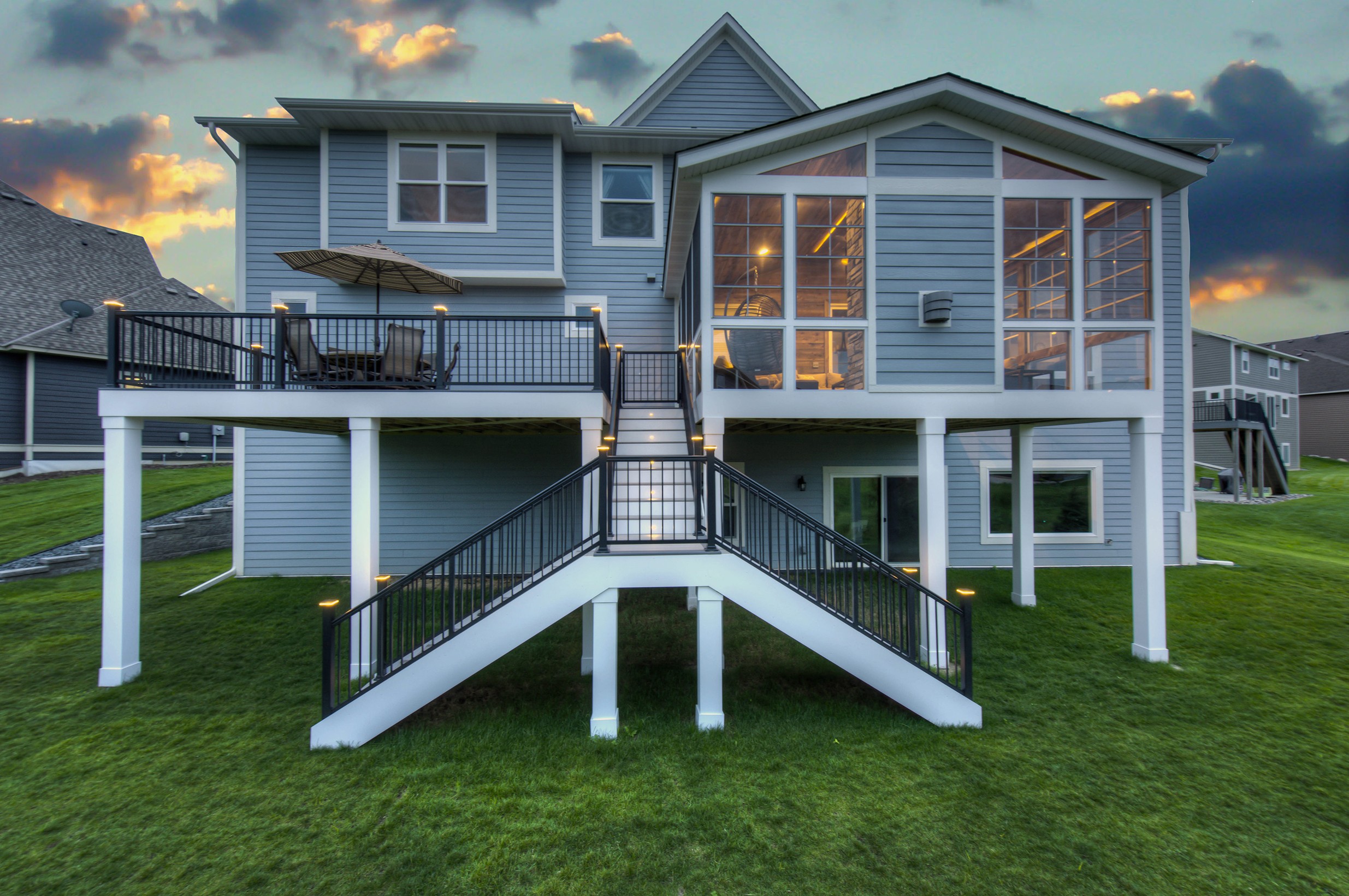 Residential Deck Aluminum Railing with Staircase Aluminum railing on residential deck and staircase at sunset