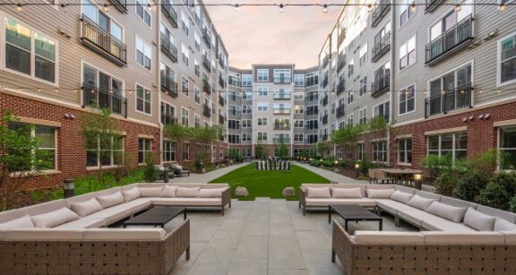 Aluminum Balcony Railing Panels Aluminum balcony railing panels on modern apartment complex overlooking courtyard